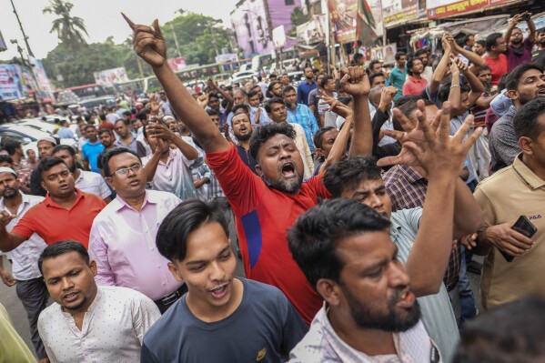 Supporters of Bangladesh's ruling Awami League party and its 13 allies denouncing the violence by the opposition, rally in Dhaka, Bangladesh, Monday, Oct.30, 2023. (AP Photo/Mahmud Hossain Opu)