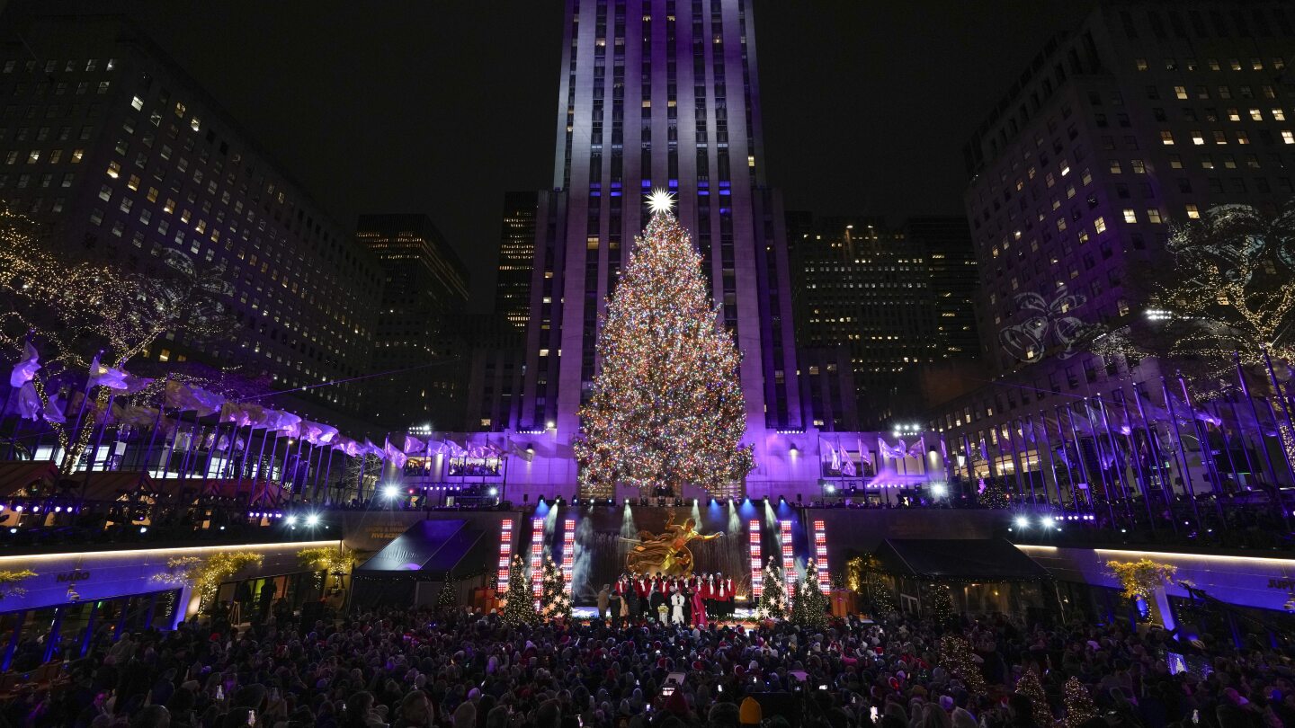 Iconic Christmas tree at Rockefeller Center illuminated AP News