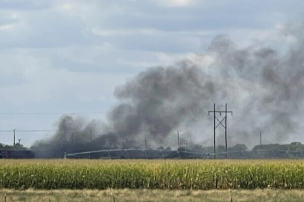 Smoke rises after an explosion at Union Pacific's Bailey Yard in North Platte, Neb., Thursday, Sept. 14, 2023. An explosion Thursday inside a shipping container generated toxic smoke and forced evacuations. (Melanie Standiford/Midwest Media via AP)