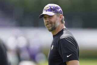 FILE - Minnesota Vikings offensive coordinator Wes Phillips looks on during the NFL football team's training camp in Eagan, Minn., July 27, 2022. Phillips was arrested Friday, Dec. 8, 2023, for suspicion of drunken driving after being stopped for speeding on a Minneapolis interstate highway. (AP Photo/Abbie Parr, File)