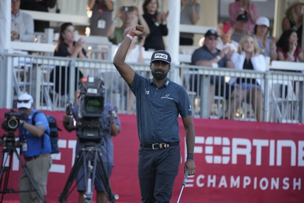 Sahith Theegala reacts on the 18th green of the Silverado Resort North Course after winning the Fortinet Championship PGA golf tournament in Napa, Calif., Sunday, Sept. 17, 2023. (AP Photo/Eric Risberg)