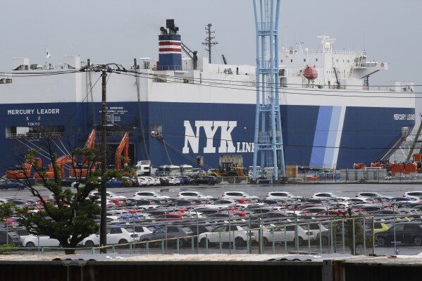 Cars for export park at a port in Yokohama, near Tokyo, on July 6, 2020. Japan sank into a trade deficit last month as exports sank for the first time in two years and five months, dragged down by a slowdown overseas, according to the Finance Ministry on Thursday, Aug. 18, 2023. (AP Photo/Koji Sasahara)