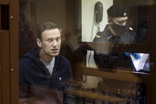 In this photo taken on Friday, Feb. 12, 2021 and provided by the Babuskinsky District Court, Russian opposition leader Alexei Navalny sits in a cage during a hearing on his charges for defamation in the Babuskinsky District Court in Moscow, Russia. A hunger strike by jailed Russian opposition leader Alexei Navalny cast a spotlight on the country’s prison system that critics say is built on fear and torment. Navalny was transferred Sunday, April 18, 2021 from his prison colony to a hospital in another prison amid reports about his declining health that drew international outrage. Nearly 520,000 inmates occupy Russia’s prison system - numerically by far the largest prison population in Europe. Most of the prisons are collective colonies, a system dating back to the Soviet Gulag era, with workshops and inmates sleeping in dormitories. (Babuskinsky District Court Press Service via AP, File)