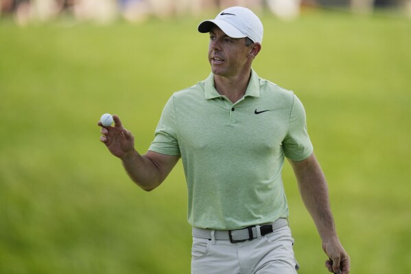 Rory McIlroy, of Northern Ireland, gestures after putting on the 17th green during the first round of the Memorial golf tournament, Thursday, June 6, 2024, in Dublin, Ohio. (AP Photo/Sue Ogrocki)