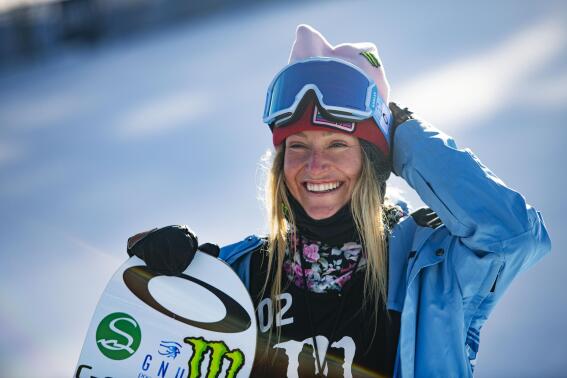 FILE - Jamie Anderson stands at the bottom of the big air course after winning her second gold medal during the Winter X Games on Sunday, Jan. 31, 2021, in Aspen, Colo. Even in a sport filled with nonconformists, Anderson stands out. The 31-year-old from South Lake Tahoe, California, is one of the most thoughtful people in her business.  (Kelsey Brunner/The Aspen Times via AP, File)