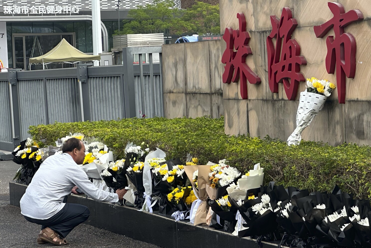 Silence descends around China’s deadliest mass killing in years as flowers cleared away