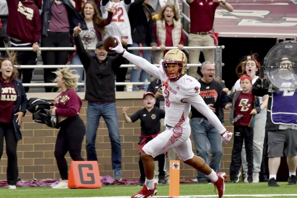 Boston College defensive back Khari Johnson returns a Florida State fumble for a touchdown during the second half of an NCAA college football game Saturday, Sept. 16, 2023 in Boston. (AP Photo/Mark Stockwell)