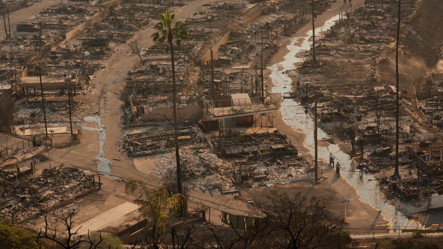 LA area’s 2 biggest blazes burn at least 10,000 structures, while new fire leads to more evacuations