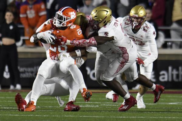 Clemson's Phil Mafah is tackled by the Boston College defense during the second half of an NCAA college football game Saturday, Oct. 8, 2022, in Boston. (AP Photo/Mark Stockwell)