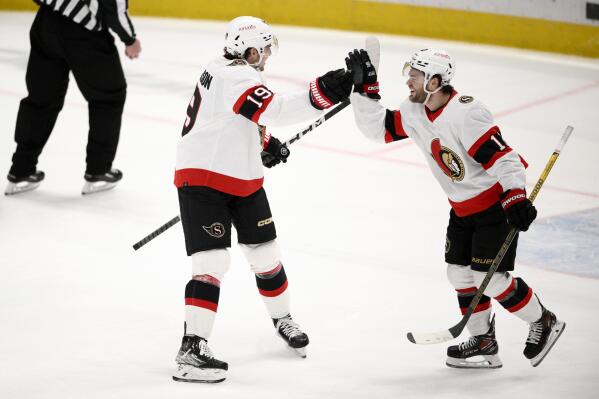 Ottawa Senators right wing Alex DeBrincat (12) celebrates after his goal with right wing Drake Batherson (19) during the third period of an NHL hockey game against the Washington Capitals, Thursday, Dec. 29, 2022, in Washington. (AP Photo/Nick Wass)