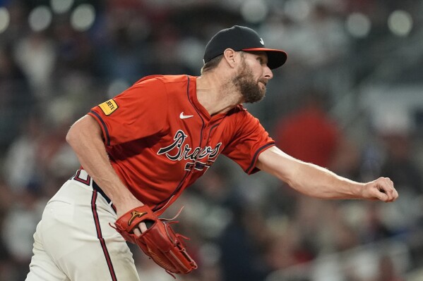 Atlanta Braves pitcher Chris Sale (51) delivers in the seventh inning against the Cleveland Guardians during a baseball game, Friday, April 26, 2024, in Atlanta. (AP Photo/Mike Stewart)