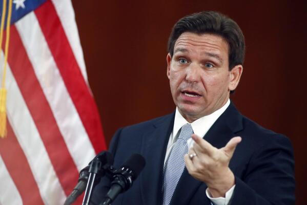Florida Gov. Ron DeSantis answers questions from the media in the Florida Cabinet following his State of the State address during a joint session of the Senate and House of Representatives Tuesday, March 7, 2023, at the Capitol in Tallahassee, Fla. (AP Photo/Phil Sears)