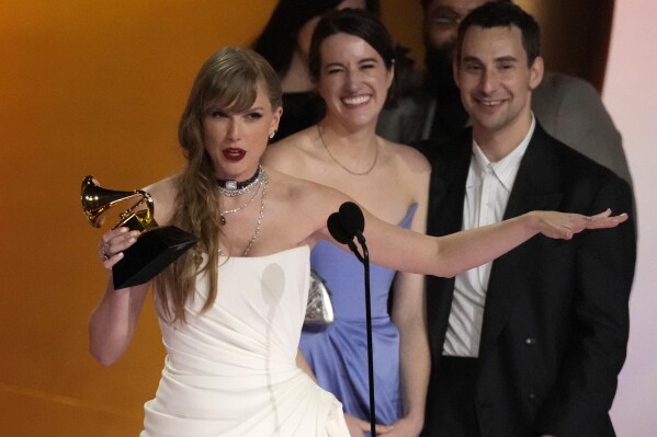 Taylor Swift accepts the award for album of the year for 