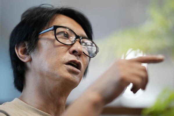 Junya Hiramoto, head of Johnny's Sexual Assault Victims Association speaks during an interview with The Associated Press Monday, Sept. 4, 2023, in Tokyo. A group of men who say they were sexually abused by a Japanese boy band producer expressed hope Monday that the company will agree to provide financial compensation and introduce measures to prevent a recurrence. (AP Photo/Eugene Hoshiko)