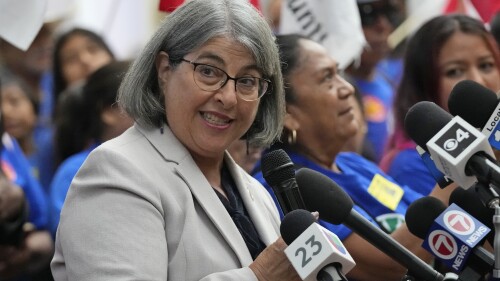 Miami-Dade County Mayor Daniella Levine Cava smiles as she speaks alongside outdoor workers demanding workplace protections against extreme heat, during a news conference, Tuesday, July 18, 2023, at the Stephen P. Clark Government Center in Miami. A Heat Standard ordinance passed the first step to becoming law at a county commission meeting Tuesday. The bill will go to a public hearing in September, then back to the full commission for a final vote. (AP Photo/Wilfredo Lee)