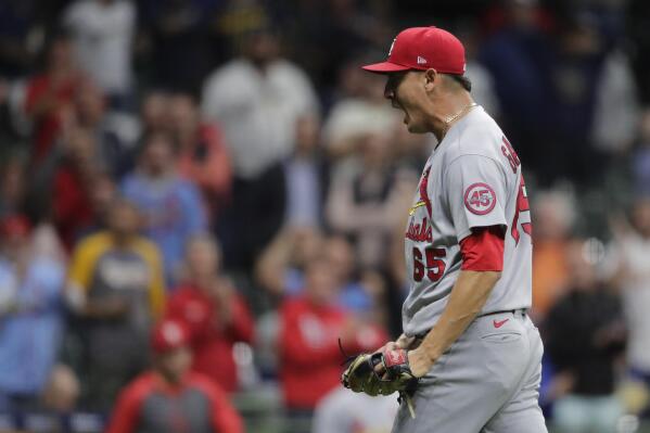 St. Louis Cardinals' Giovanny Gallegos reacts after striking out the final batter of the game to record a save during the ninth inning of a baseball game against the Milwaukee Brewers Tuesday, Sept. 21, 2021, in Milwaukee. (AP Photo/Aaron Gash)