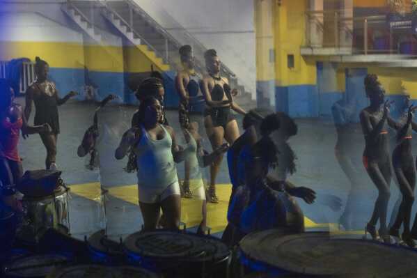 Transgender women take a samba class at the Paraiso de Tuiuti samba school ahead of the Carnival parade in Rio Janeiro, Wednesday, Feb. 5, 2025. (AP Photo/Silvia Izquierdo)