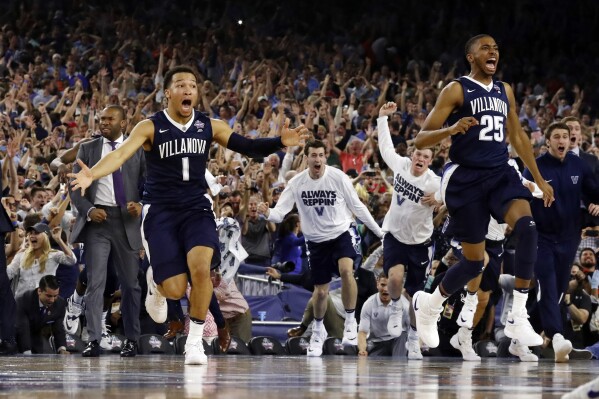 FILE - Villanova's Jalen Brunson (1), Mikal Bridges (25) and their teammates celebrate after the NCAA Final Four tournament college basketball championship game against North Carolina, Monday, April 4, 2016, in Houston. Villanova won 77-74. (AP Photo/David J. Phillip, File)