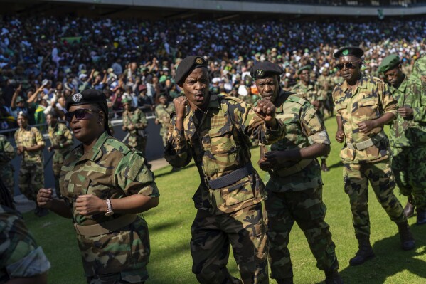 Veteran fighters parade as they wait for former South African President Jacob Zuma to arrive at Orlando stadium in the township of Soweto, Johannesburg, South Africa, for the launch of his newly formed uMkhonto weSizwe (MK) party's manifesto Saturday, May 18, 2024. Zuma, who has turned his back on the African National Congress (ANC) he once led, will face South African President Cyril Ramaphosa, who replaced him as leader of the ANC in the general elections later in May. (AP Photo/Jerome Delay)