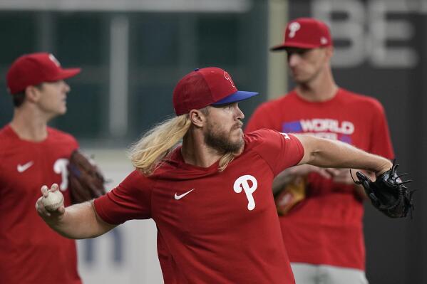 Philadelphia Phillies Noah Syndergaard warms up during batting practice before Game 1 of baseball's World Series between the Houston Astros and the Philadelphia Phillies on Friday, Oct. 28, 2022, in Houston. (AP Photo/Eric Gay)