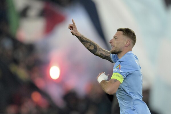 Lazio's Ciro Immobile celebrates after scoring his side's first goal during a Champions League round of 16 first leg soccer match between Lazio and Bayern Munich, at Rome's Olympic Stadium, Wednesday, Feb. 14, 2024. (Alfredo Falcone/LaPresse via AP)
