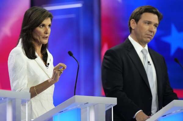 Republican presidential candidate former U.N. Ambassador Nikki Haley speaks as Florida Gov. Ron DeSantis listens during a Republican presidential primary debate hosted by NBC News, Wednesday, Nov. 8, 2023, at the Adrienne Arsht Center for the Performing Arts of Miami-Dade County in Miami. (AP Photo/Rebecca Blackwell)