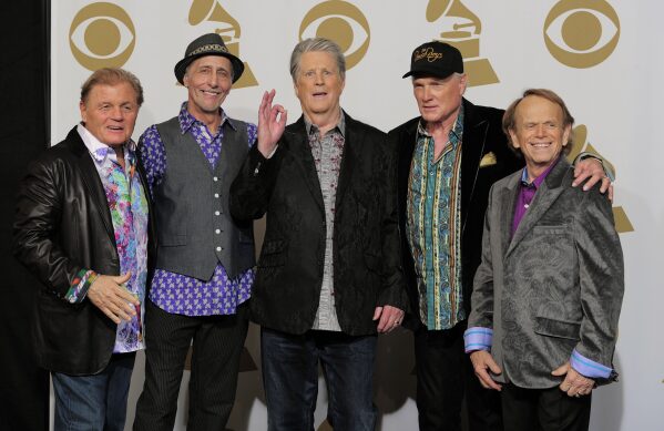 Members of The Beach Boys, from left, Bruce Johnston, David Marks, Brian Wilson, Mike Love and Al Jardine appear backstage at the 54th annual Grammy Awards in Los Angeles on Feb. 12, 2012. (AP Photo/Mark J. Terrill, File)