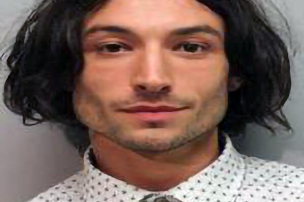 REPLACES HE WITH MILLER - This photo provided by the Hawai'i Police Department shows actor Ezra Miller who was arrested and charged for disorderly conduct and harassment Sunday after an incident at a bar in Hilo. Miller known for playing "The Flash" in "Justice League" films was arrested after an incident at a Hawaii karaoke bar, where police say Miller yelled obscenities, grabbed a mic from a singing woman and lunged at a man playing darts. (Hawai'i Police Department via AP)