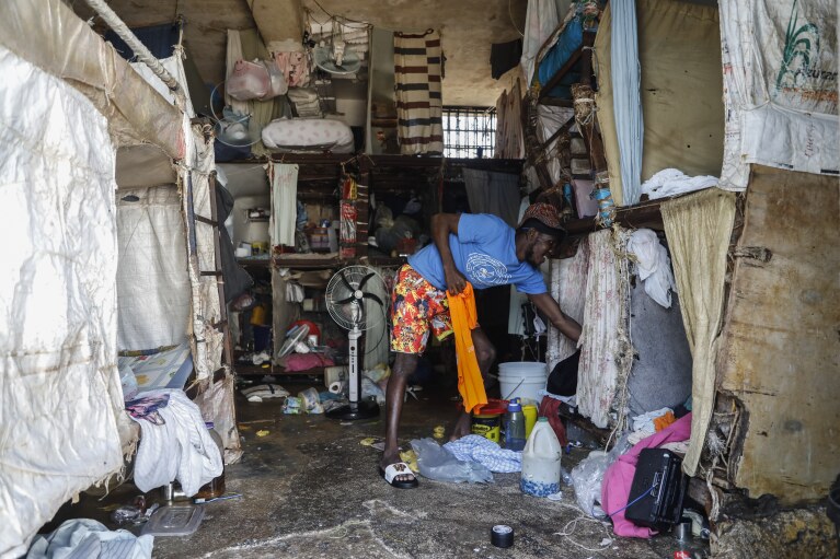 An inmate stands at the National Penitentiary in downtown Port-au-Prince, Haiti, Sunday, March 3, 2024. (AP Photo/Odelyn Joseph)