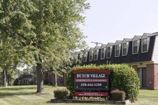 FILE - In this July 29, 2019, photo, a sign sits outside the Dutch Village apartments and townhomes, owned by the Kushner Cos., in Baltimore. The property management company owned by the family of former President Donald Trump’s son-in-law, Jared Kushner, has agreed to pay a $3.25 million civil penalty and restitution to settle a 2019 lawsuit in Maryland over allegations of charging tenants illegal fees and failing to maintain properties, Attorney General Brian Frosh announced Friday, Sept. 23, 2022.  (AP Photo/Steve Ruark, File)