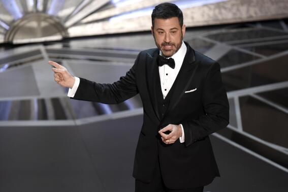 FILE - Host Jimmy Kimmel speaks at the Oscars in Los Angeles on March 4, 2018. Kimmel will again preside over the ceremony in March, the show’s producers said Monday. (Photo by Chris Pizzello/Invision/AP, File)