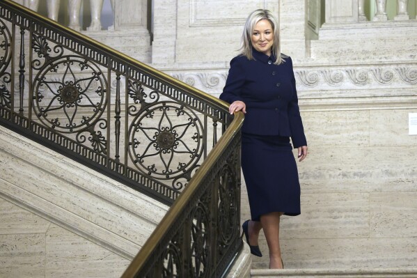 Sinn Fein Vice President Michelle O'Neill walks through Stormont Parliament Buildings in Belfast, Northern Ireland, Saturday, Feb. 3, 2024. O'Neill is poised to make history by becoming the first Irish nationalist leader of Northern Ireland as the government returned to work after a two-year boycott by unionists.(AP Photo/Peter Morrison)
