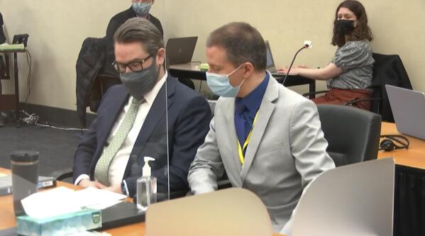 In this image from video, defense attorney Eric Nelson, left, and defendant, former Minneapolis police officer Derek Chauvin listen to Hennepin County Judge Peter Cahill read instructions to the jury before closing arguments, Monday, April 19, 2021, in the trial of Chauvin at the Hennepin County Courthouse in Minneapolis. Chauvin is charged in the May 25, 2020 death of George Floyd. (Court TV via AP, Pool)