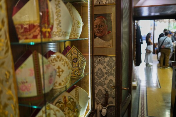 A painting hangs inside the dressing room of the Gammarelli Ecclesiastic clothes tailor shop in Rome, Wednesday, April 30, 2025. (AP Photo/Francisco Seco)