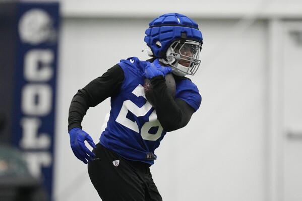 Indianapolis Colts' Jonathan Taylor runs a drill during an NFL football practice, Thursday, Oct. 5, 2023, in Indianapolis. (AP Photo/Darron Cummings)