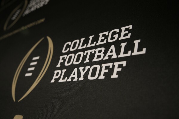 FILE - The College Football Playoff logo is printed across a backdrop during a news conference where the 13 members of the committee were announced, Wednesday, Oct. 16, 2013, in Irving, Texas. The 12-team College Football Playoff that was unveiled in 2021 looked like an exciting evolution of the postseason, with potential to boost the entire sport. (AP Photo/Tony Gutierrez, File)