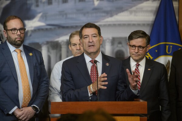 Rep. Mark Green, R-Tenn., center, is joined by from left: Rep. Jason Smith, R-Mo., Rep. Jim Jordan, R-Ohio, and Speaker of the House Mike Johnson, R-La., right, during a news conference at the Capitol, Tuesday, May 20, 2025, in Washington. (AP Photo/Rod Lamkey, Jr., File)