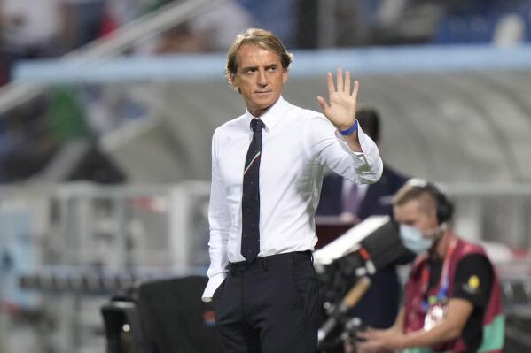 Italy's coach Roberto Mancini applauds fans ahead of the World Cup 2022 qualifier group C soccer match between Italy and Lithuania at the Città del Tricolore stadium in Reggio Emilia, Italy, Wednesday, Sept. 8, 2021. (AP Photo/Luca Bruno)