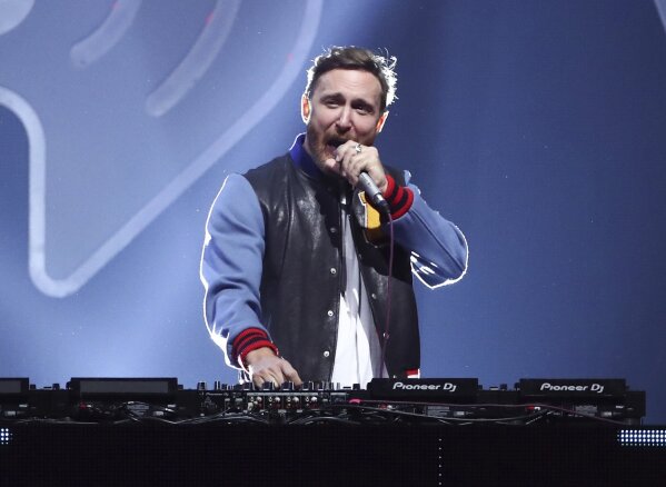 FILE - This Sept. 22, 2017 file photo shows DJ-producer David Guetta performing at the 2017 iHeartRadio Music Festival in Las Vegas. When hundreds of artists started singing from their living rooms when the coronavirus pandemic hit, the Grammy-winning DJ-producer still wanted to perform in front of a live audience. So the hitmaker set up shop at Icon Brickell in downtown Miami, performing outdoors for 90 minutes as 8,000 locals danced along from their balconies during the feel-good moment last month. Now, he’s launching his second United At Home event at an undisclosed location in New York on Saturday to connect with fans and raise money for health care workers and virus relief efforts. (Photo by John Salangsang/Invision/AP, File)