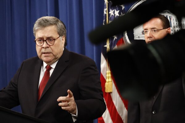 
              Attorney General William Barr speaks alongside Deputy Attorney General Rod Rosenstein about the release of a redacted version of special counsel Robert Mueller's report during a news conference, Thursday, April 18, 2019, at the Department of Justice in Washington. (AP Photo/Patrick Semansky)
            
