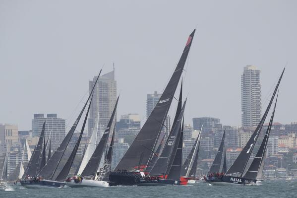 FILE - Part of the fleet head towards the start line during the start of the Sydney Hobart yacht race on Sydney Harbour, Thursday, Dec. 26, 2019. For the first time since 2019 the Sydney to Hobart is back to its old self. A bevy of international yachts and sailors are contesting one of the world’s most grueling ocean races from Monday, Dec. 26, 2022. (AP Photo/Steve Chirsto, File)