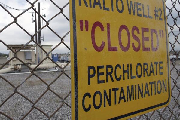 FILE - A sign is posted outside a water well indicates perchlorate contamination at a site in Rialto, Calif., March 28, 2005. A federal appeals court ruled Tuesday, May 9, 2023, that the Environmental Protection Agency must regulate perchlorate, reversing a Trump-era rollback on a drinking water contaminant linked to brain damage in infants. (AP Photo/Ric Francis, File)