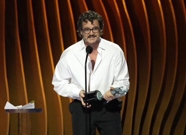 Pedro Pascal accepts the award for outstanding performance by a male actor in a drama series for "The Last of Us" during the 30th annual Screen Actors Guild Awards on Saturday, Feb. 24, 2024, at the Shrine Auditorium in Los Angeles. (AP Photo/Chris Pizzello)