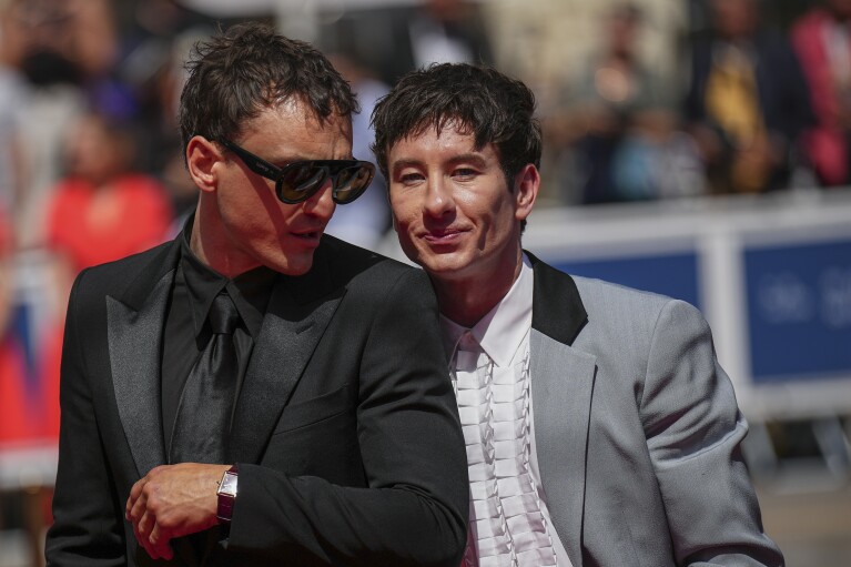 Franz Rogowski, left, and Barry Keoghan pose for photographers upon arrival at the premiere of the film 'Bird' at the 77th international film festival, Cannes, southern France, Thursday, May 16, 2024. (Photo by Daniel Cole/Invision/AP)