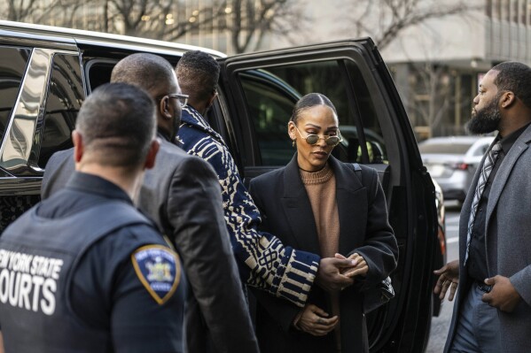 Jonathan Majors and Meagan Good arrive at Criminal Court on Monday, April 8, 2024 in New York. (AP Photo/Brittainy Newman)