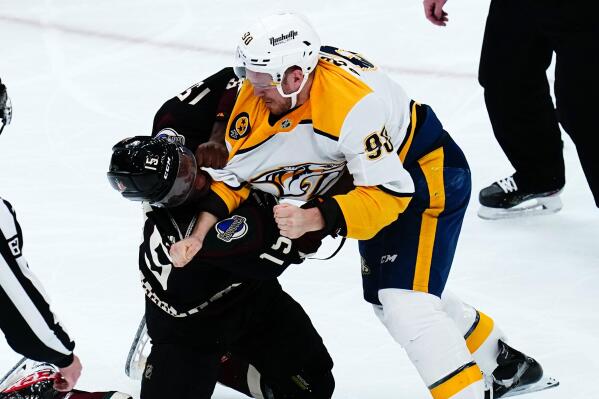 Nashville Predators defenseman Mark Borowiecki (90) fights with Arizona Coyotes left wing Bokondji Imama (15) during the first period of an NHL hockey game Friday, April 29, 2022, in Glendale, Ariz. (AP Photo/Ross D. Franklin)