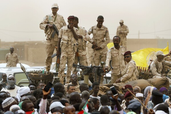 Sudanese soldiers from the Rapid Support Forces unit stand on their vehicle during a military-backed rally, in Mayo district, south of Khartoum, Sudan, Saturday, June 29, 2019. The United States imposed sanctions Wednesday, Sept. 6, 2023, on a Sudanese Rapid Support Forces paramilitary commander Abdelrahim Hamdan Dagalo for acts of violence and human rights abuses committed by his troops in their monthslong conflict with Sudan's army. (AP Photo/Hussein Malla, File)