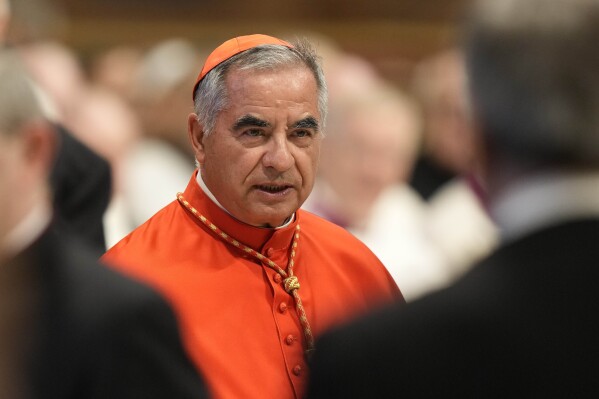 FILE - Cardinal Angelo Becciu attends the consistory inside St. Peter's Basilica at the Vatican, on Aug. 27, 2022. Lawyers for a once-powerful cardinal accused Vatican prosecutors of being 鈥減risoners to their completely shattered theory鈥� on Wednesday Nov. 22, 2023 in the latest round of closing arguments of a big trial that have raised fundamental questions about the prosecutors鈥� case and the rule of law in the city state. Despite attempts to demonize Becciu, the two-year trial hasn鈥檛 proved any of the prosecutors' allegations of embezzlement, abuse of office or witness tampering against him, said attorneys Maria Concetta Marzo e Fabio Viglione. (AP Photo/Andrew Medichini, File)