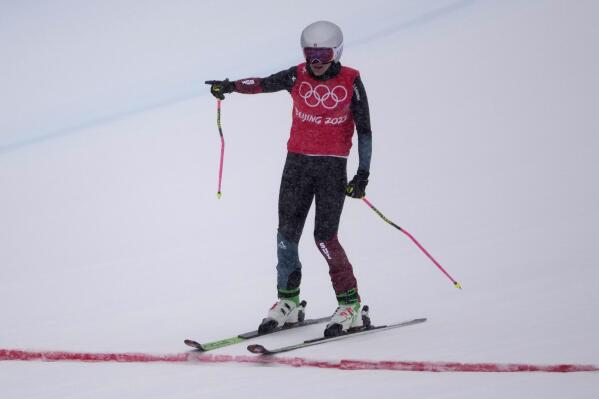 Switzerland's Fanny Smith reacts as she crosses the finish during the women's cross finals at the 2022 Winter Olympics, Thursday, Feb. 17, 2022, in Zhangjiakou, China. (AP Photo/Aaron Favila)