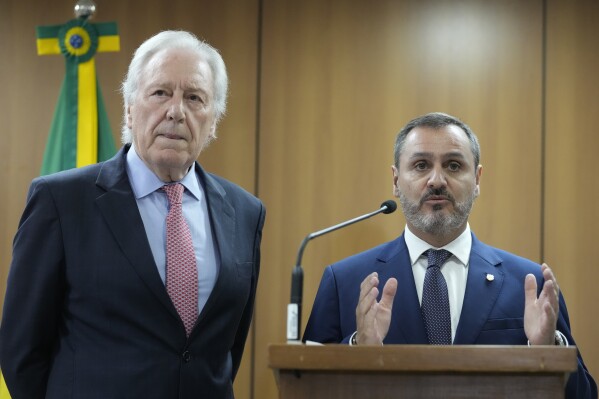 Brazil's Director of the Federal Police Andrei Rodrigues speaks next to Minister of Justice, Ricardo Lewandowski, a press conference concerning the arrest of suspects accused of ordering the killing of Rio de Janeiro councilwoman Marielle Franco, in Brasilia, Brazil, Sunday, March 24, 2024. Brazil's federal police arrested on Sunday the men suspected of ordering the killing of Franco in 2018. (AP Photo/Eraldo Peres)